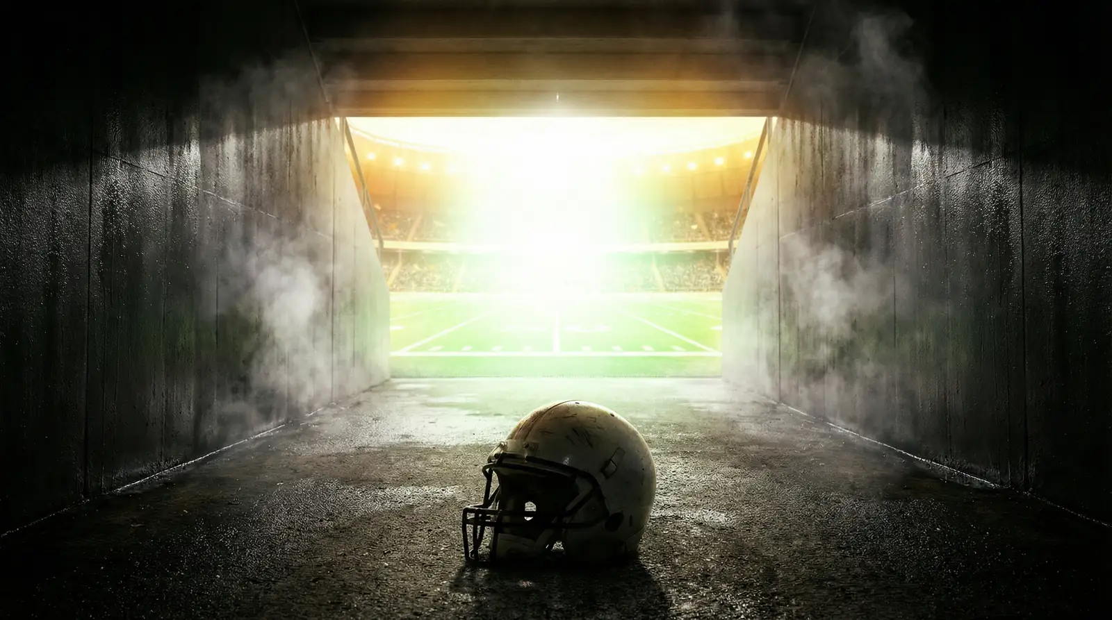 Túnel de vestuario de un estadio de fútbol americano con luz al final simbolizando la postemporada